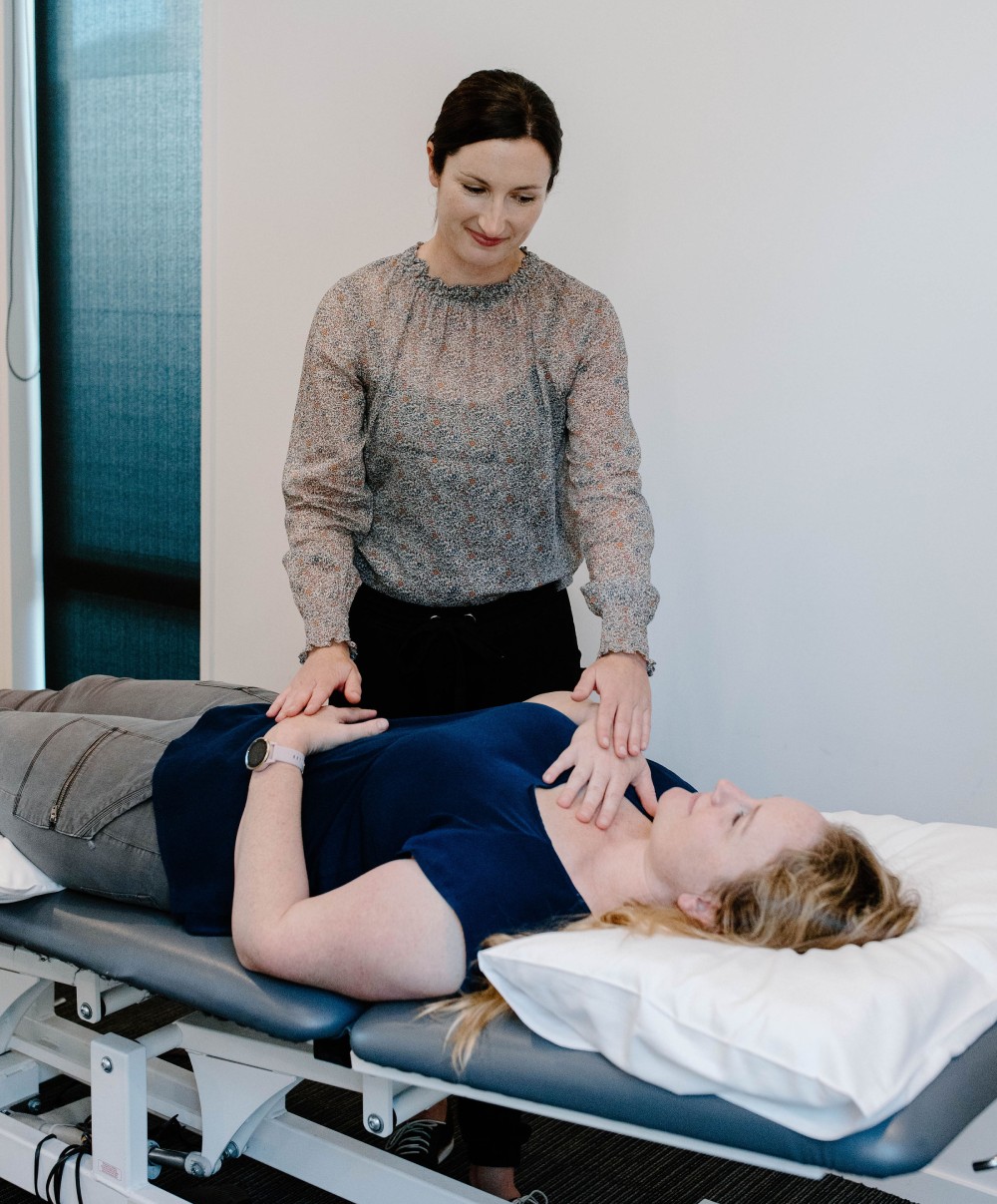 Patient learning how to breathe well for better health with a physiotherapist Christchurch